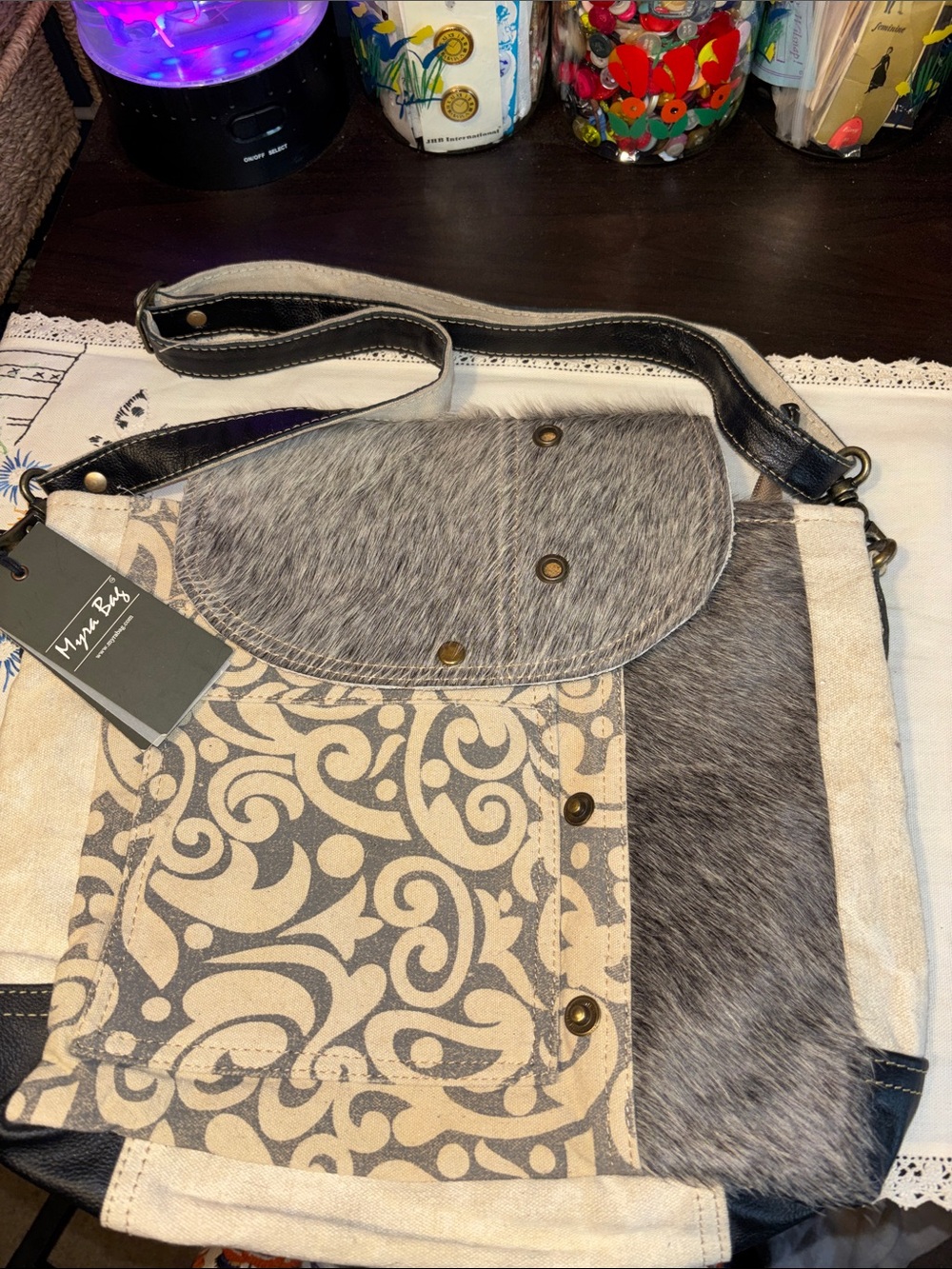 NWOT Myra Bag Factual Messenger Bag featuring a gray-and-cream swirl print with